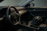 "A stylish car dashboard with mounted phone holder, steering wheel cover, sunglasses, and bike helmet placed nearby. Clean modern background. Realistic photo style."